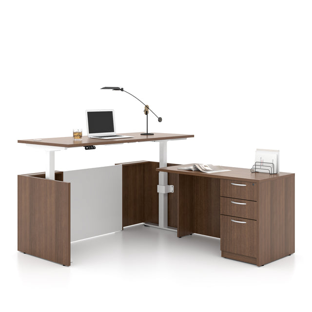 Modern office desk with adjustable height, laptop, lamp, and office supplies on a white background